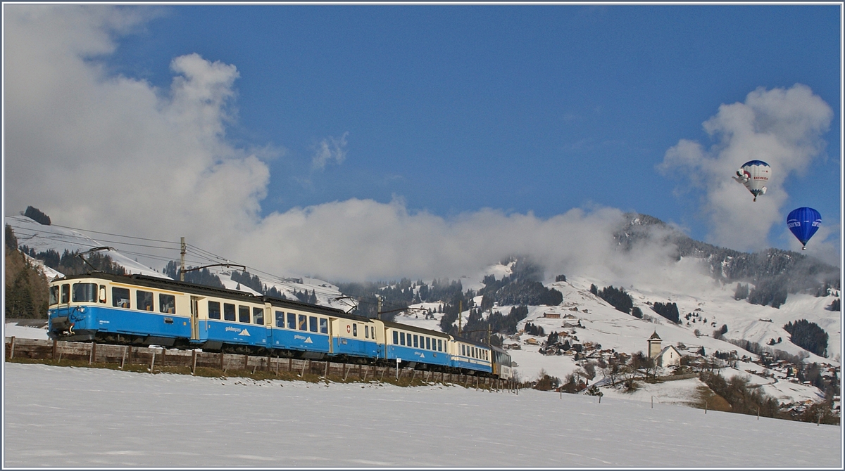 Der MOB ABDe 8/8 4001  SUISSE  mit einem Regionalzug nach Montreux kurz nach Château d'Oex, wo gerade das Ballon Festival statt findet.
28.02.2013