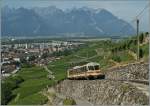Der A-L Regionalzug erklimmt gleich nach der Spitzkhere in Aigle Dépôt die Zahnradstrecke Richtung Leysin.